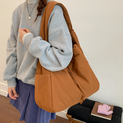 日单休闲大容量抽绳单肩托特包