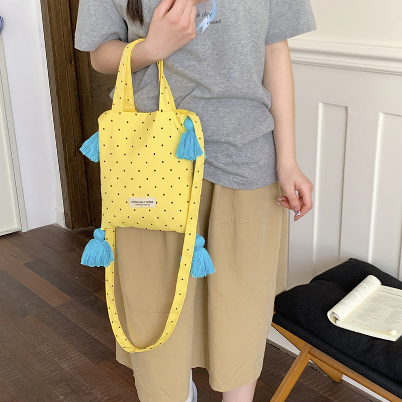 小清新波点斜挎手机包女式旅行出片流苏帆布袋手提包少女心遛弯包图片
