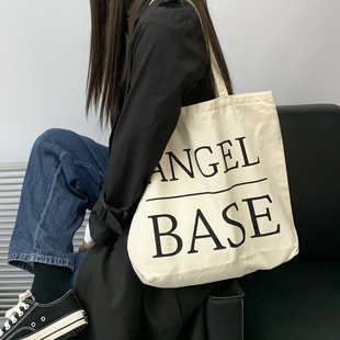 大容量字母帆布包包女有拉链逛街上班学生通勤手提补习托特书包袋