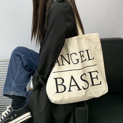 新款有拉链字母帆布女通勤包