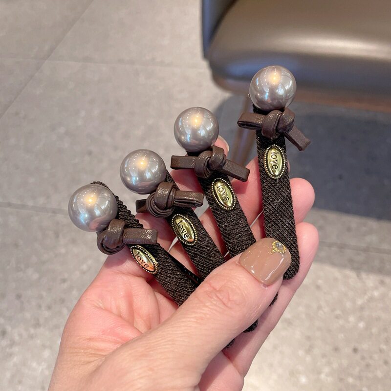 高级感珍珠蝴蝶结鸭嘴夹