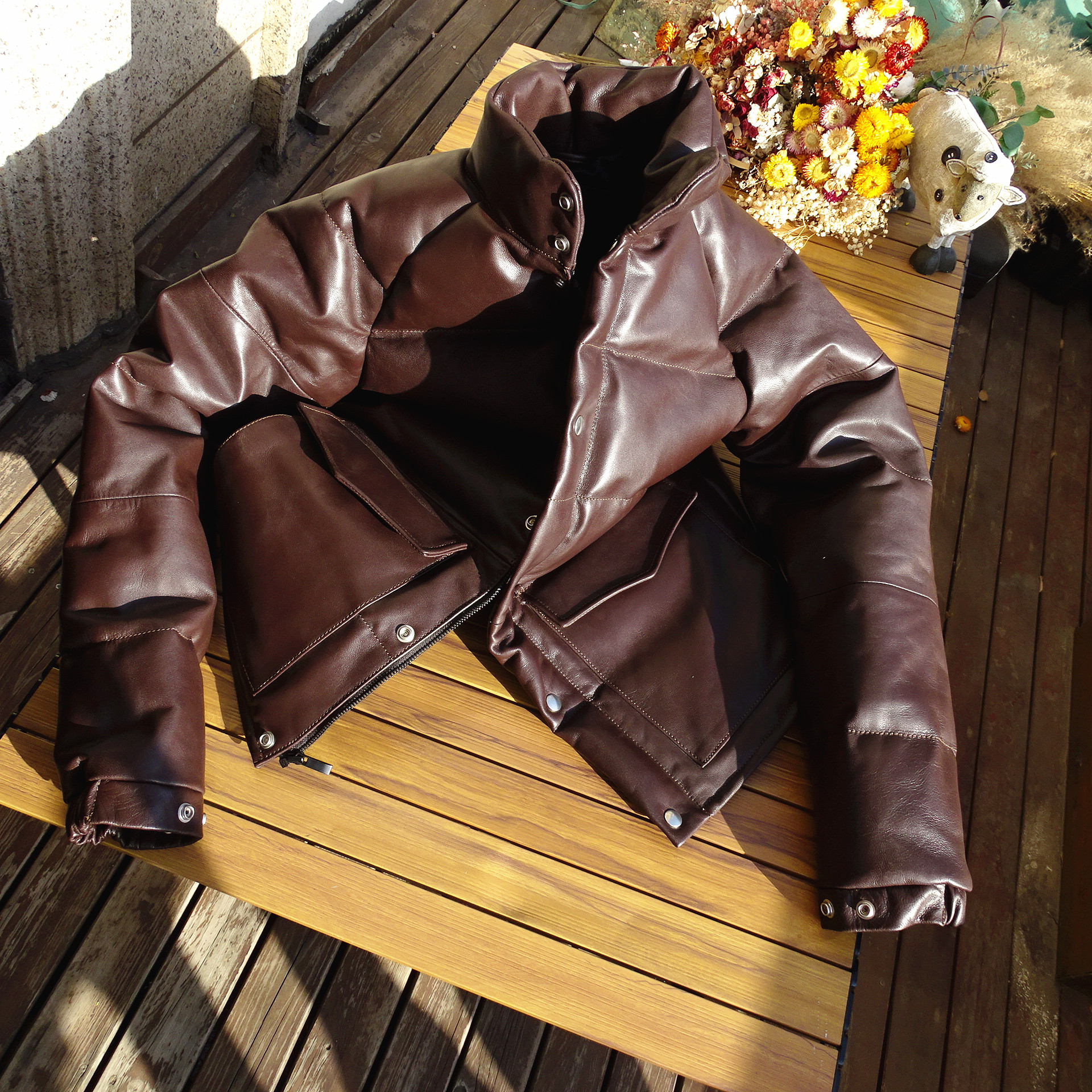 硬挺山羊皮木村皮羽绒服