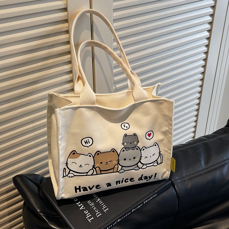 可爱卡通帆布包女2025新款休闲大容量单肩包上班族时尚手提便当袋,箱包皮具/热销女包/男包,通用款女包,淘宝优惠券,粉丝福利购,淘宝优惠卷