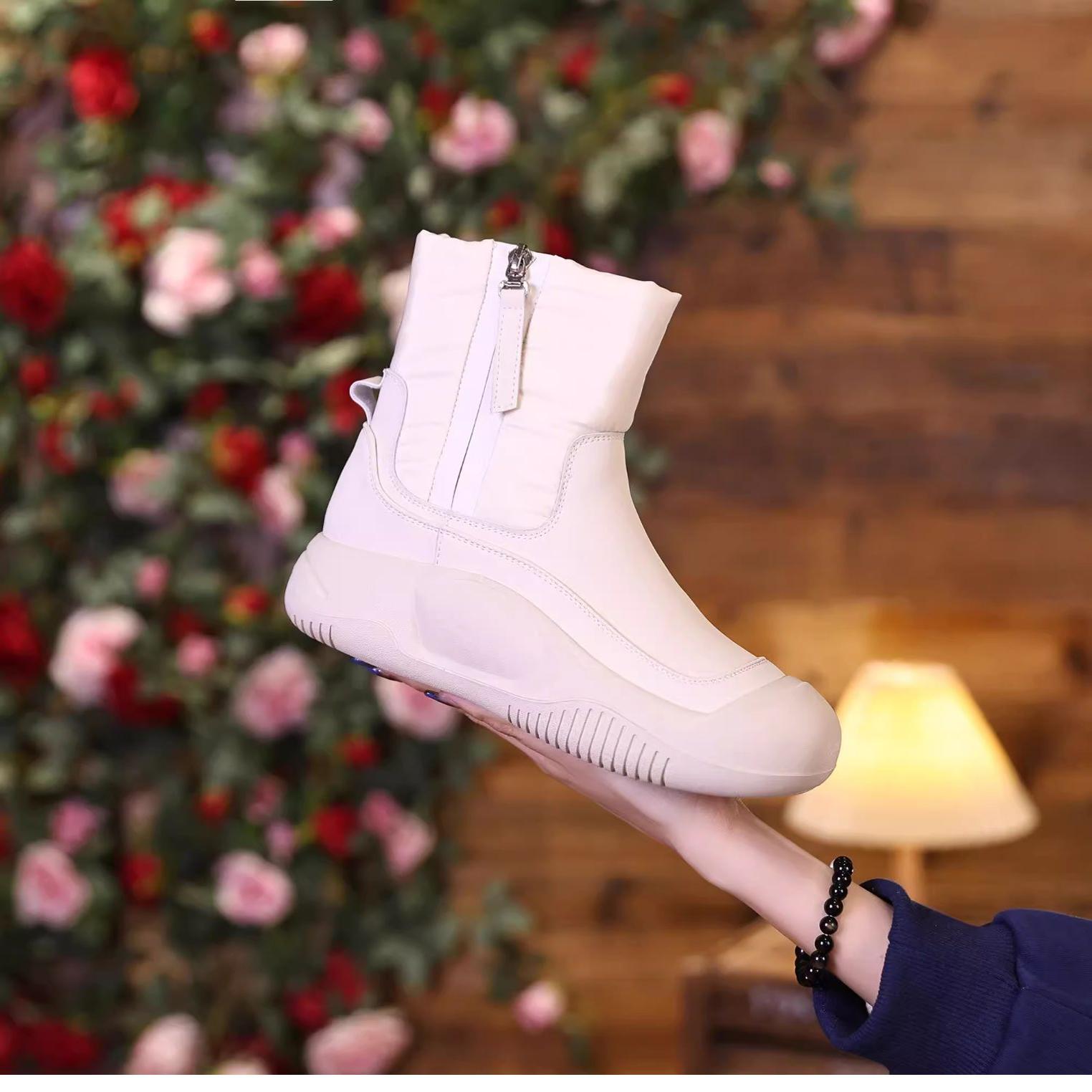 啄木鸟品牌真皮雪地靴女防水防滑马丁靴加绒加厚保暖棉鞋2025秋冬