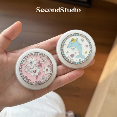 会转圈圈的开心海豚手机支架磁吸