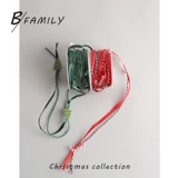 Зеленая красная лента, подарочная коробка, упаковка с бантиком