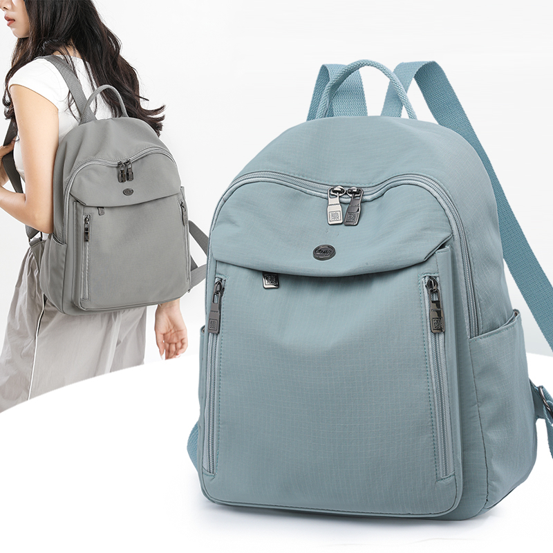 女士休闲百搭双肩包2025新款纯色简约轻便旅游通勤大容量实用书包