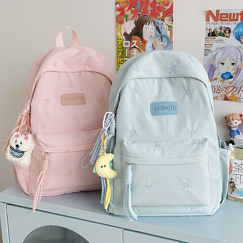 小学生新款蓝色蝴蝶结双肩背包