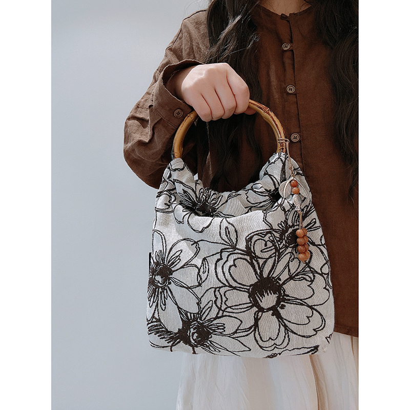 三色补丁樱花手腕包女2025春夏新款百搭通勤文艺包包复古风手提包