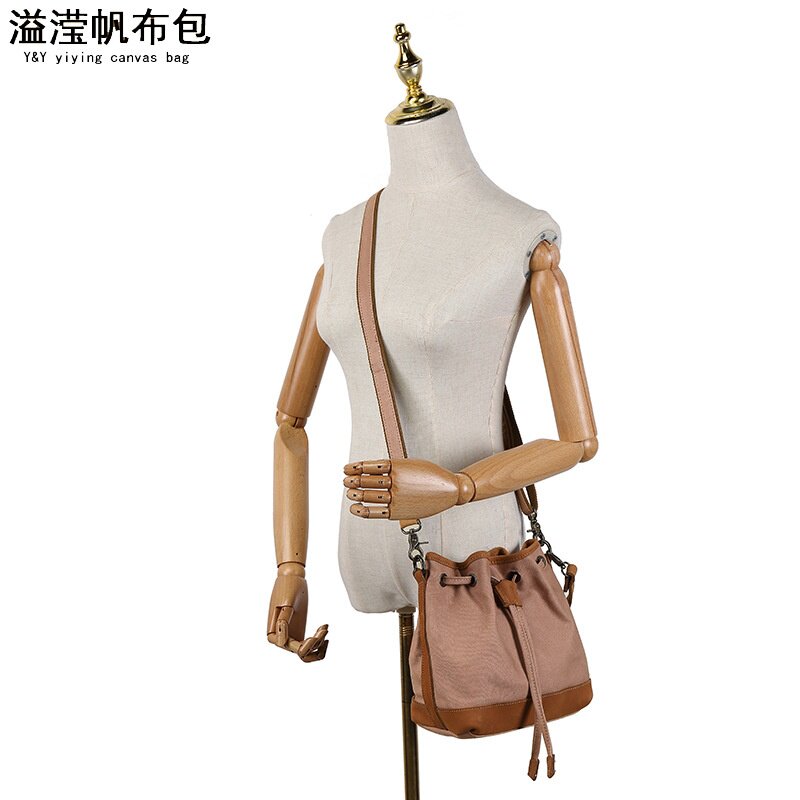 欧美时尚休闲女手提包 防水帆布斜跨包 配头层真皮纯色单肩包溢滢