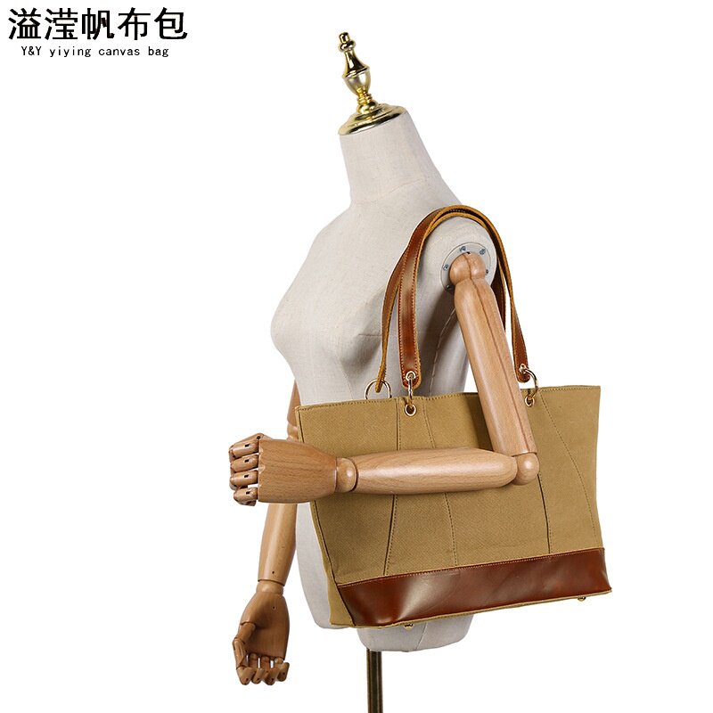 欧美时尚休闲女手提包 防水帆布斜跨包 配头层真皮纯色单肩包溢滢