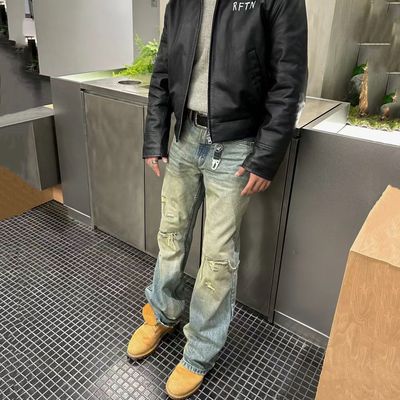 高盎司做旧毛边破坏微喇牛仔裤男