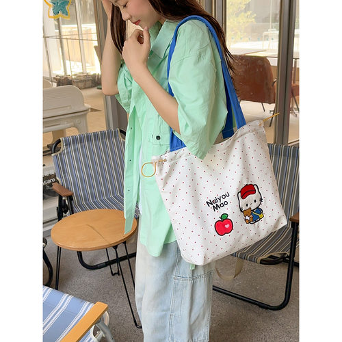 KT猫刺绣格子翻盖通勤双肩包女