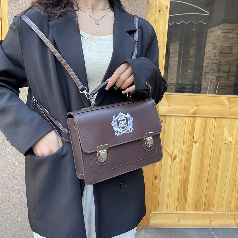 日系JK制服包包女新款单肩包学院风背包通勤大容量邮差双肩包