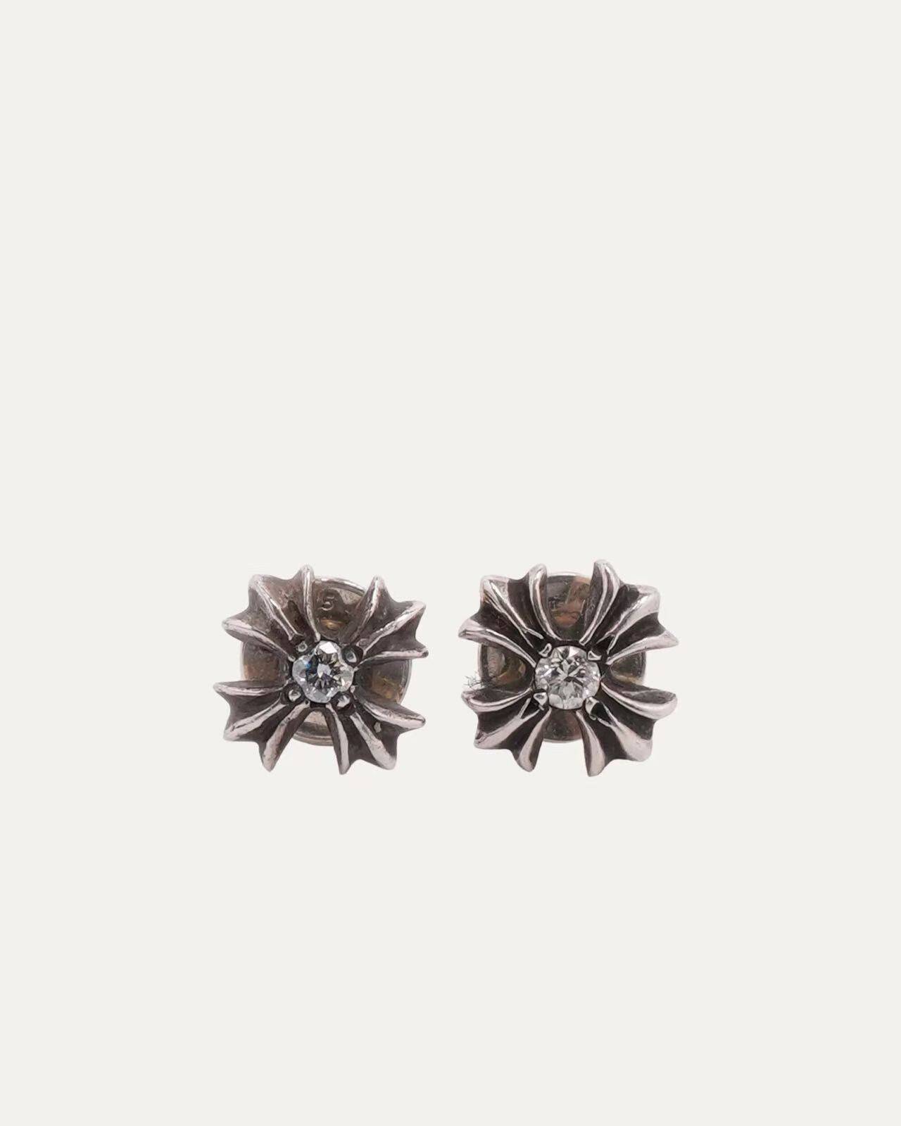 thumbnail for A pair of silver-decorated cross earrings from Huoyintang are included