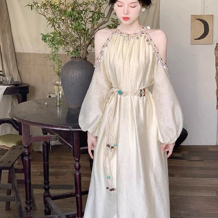 新疆旅游穿搭杏色裙夏季新款波西米亚连衣裙女云南草原青海配腰带