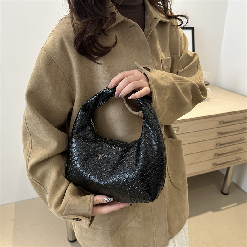 法式高级感编织包女2025新款洋气饺子包小众质感通勤包百搭手提包