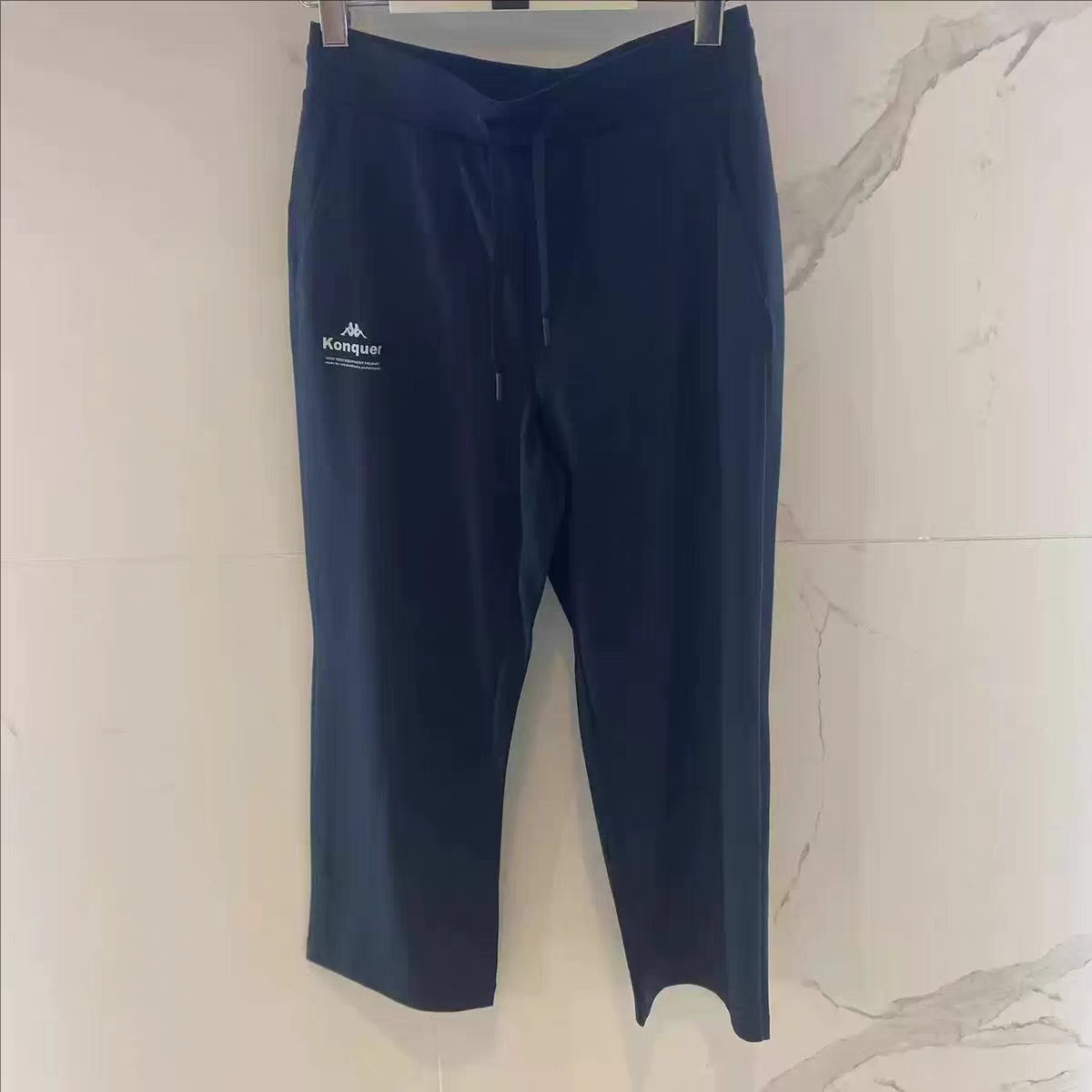 卡帕背靠背Kappa女子2025夏款运动休闲长裤9分裤K0F42CJ43