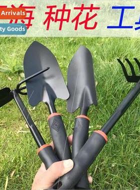 Gardening tools rake hoe two busy catching the sea small too