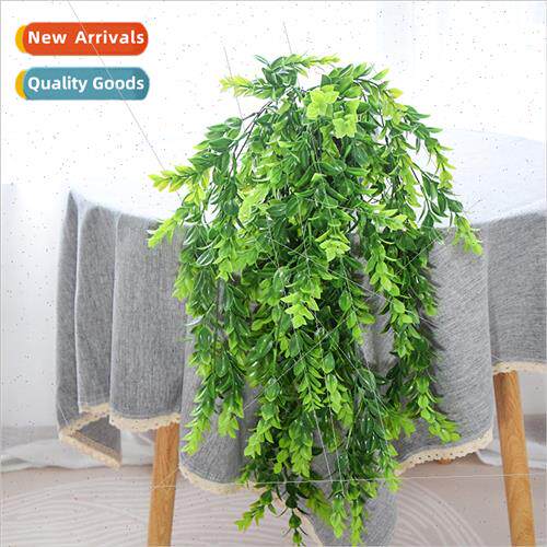 Plastic large multi-leaf grass green simulation over river d