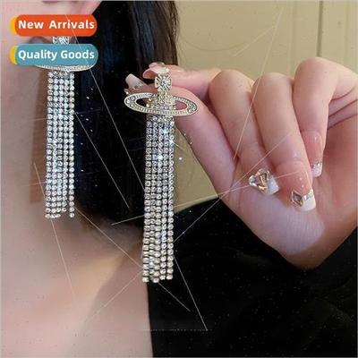 Saturn inves sexy burst hollowed out planet tassel earrings