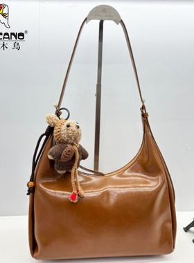 TUCANO/啄木鸟商场同款女包2025新款小众腋下包高档牛角包TBK6611