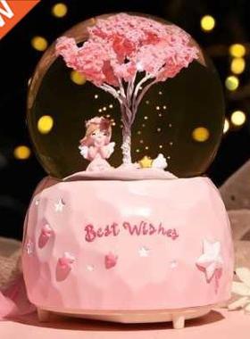 Rotating crystal ball automatically falling in the snow Love