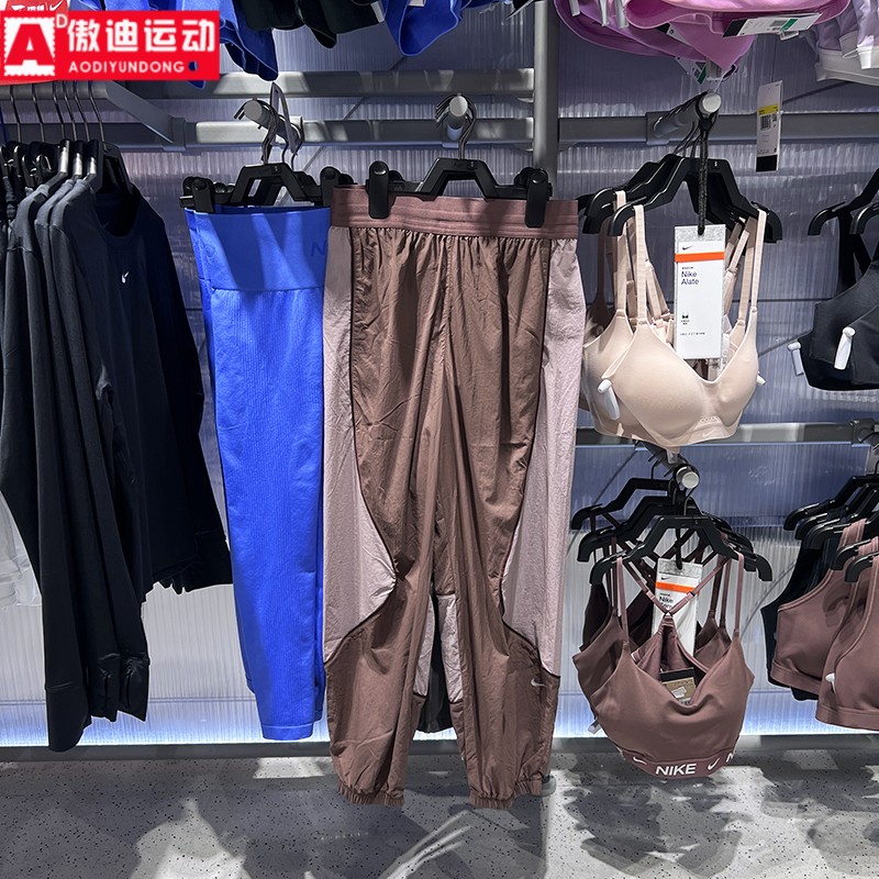 耐克女裤2026春新款时尚拼接梭织透气束脚运动休闲长裤IQ0182-502