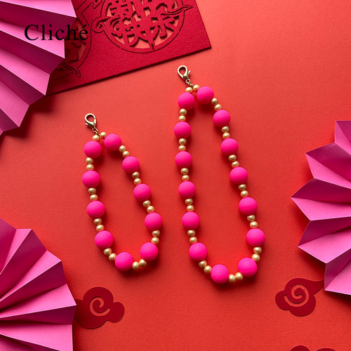 Candies玫红金色串珠手提链