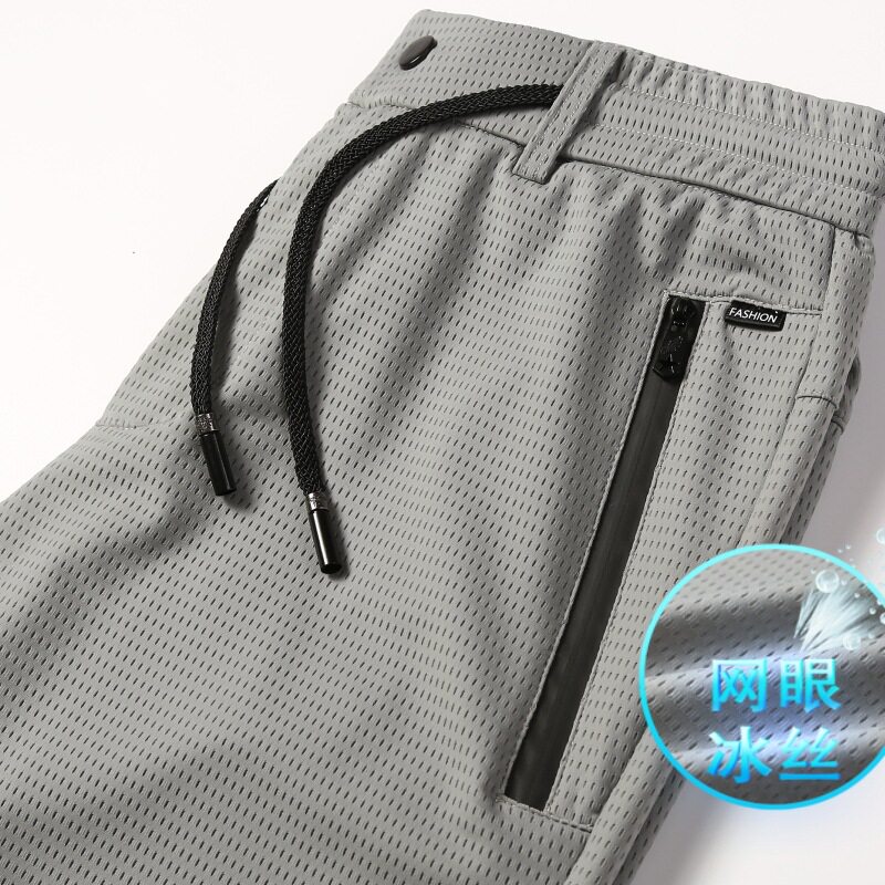 春夏季薄款冰丝男裤子透气网眼休闲裤男士加肥加大码运动速干男裤