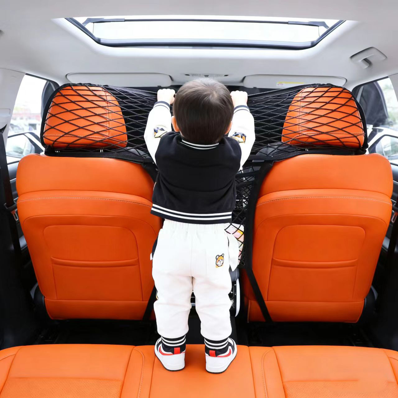 汽车座椅中间网兜储物袋中控挡小孩隔离网车内安全防护网隔断神器