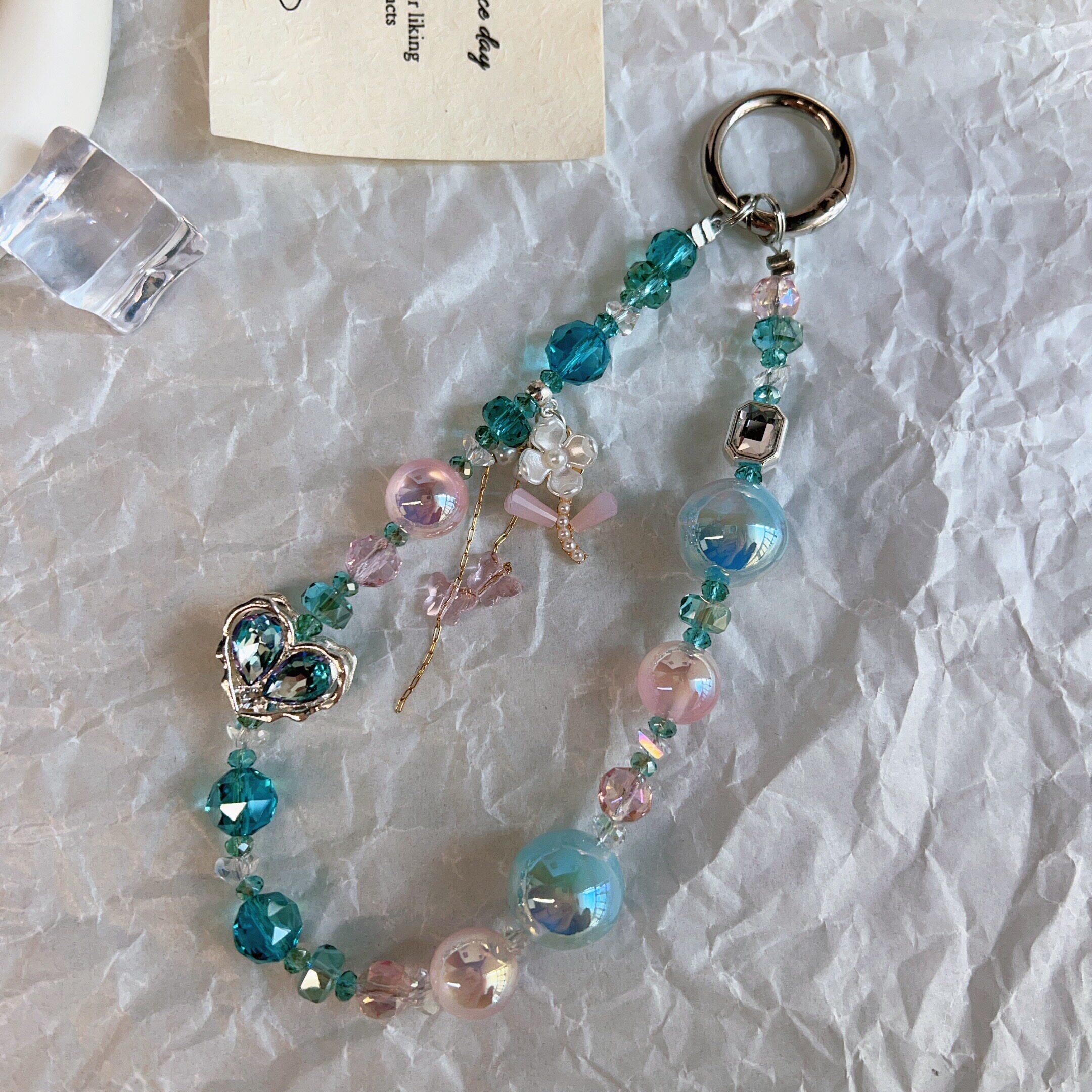 精致高级感手机链女手腕水晶挂件小众轻奢高档手工串珠饰品孔雀蓝