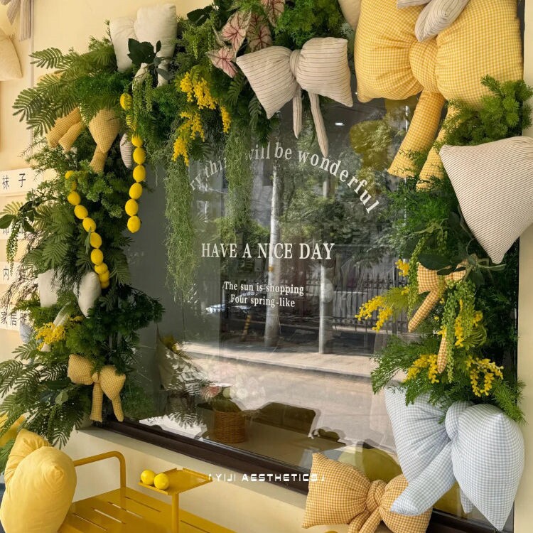 奶油黄布艺蝴蝶结童装店母婴店橱窗门头半周岁宴温馨森系仿真花