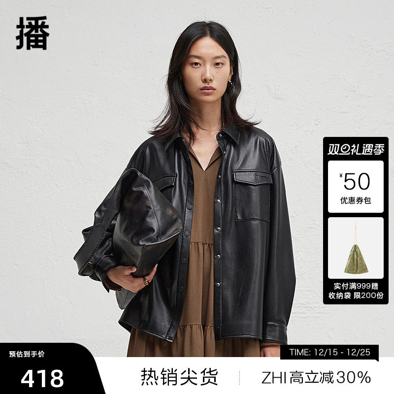 前短后长微开衩下摆，.袖口一粒扣点缀