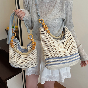 海边度假大容量编织包包女2026新款春夏通勤斜挎包镂空沙滩托特包
