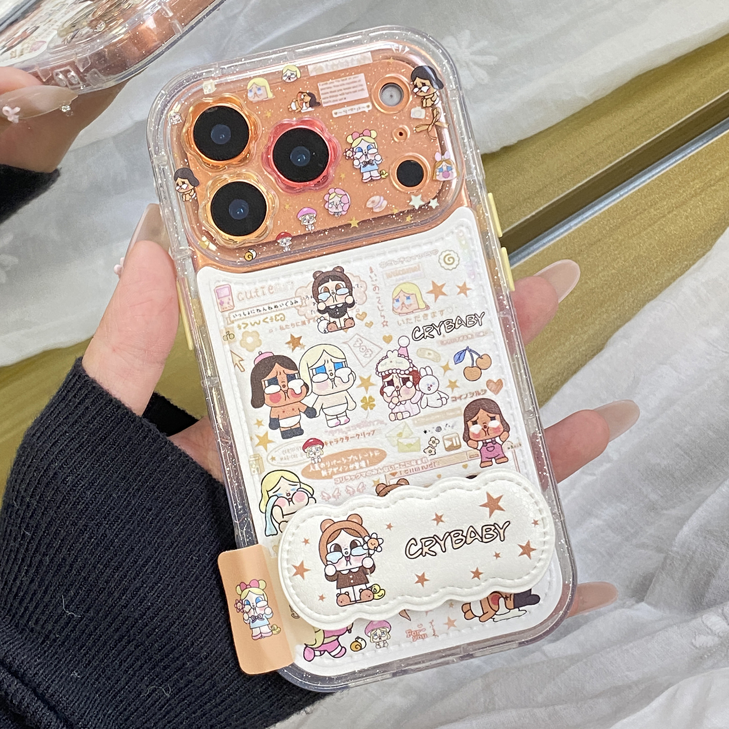 趣味可爱满屏哭娃适用于苹果17pro手机壳iphone16保护套14折叠支架13全包防摔新款15promax创意max超火手机套