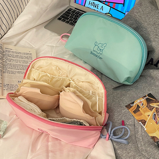 ins简约化妆包女2026新款卡通线条小狗收纳包便携式化妆品收纳包