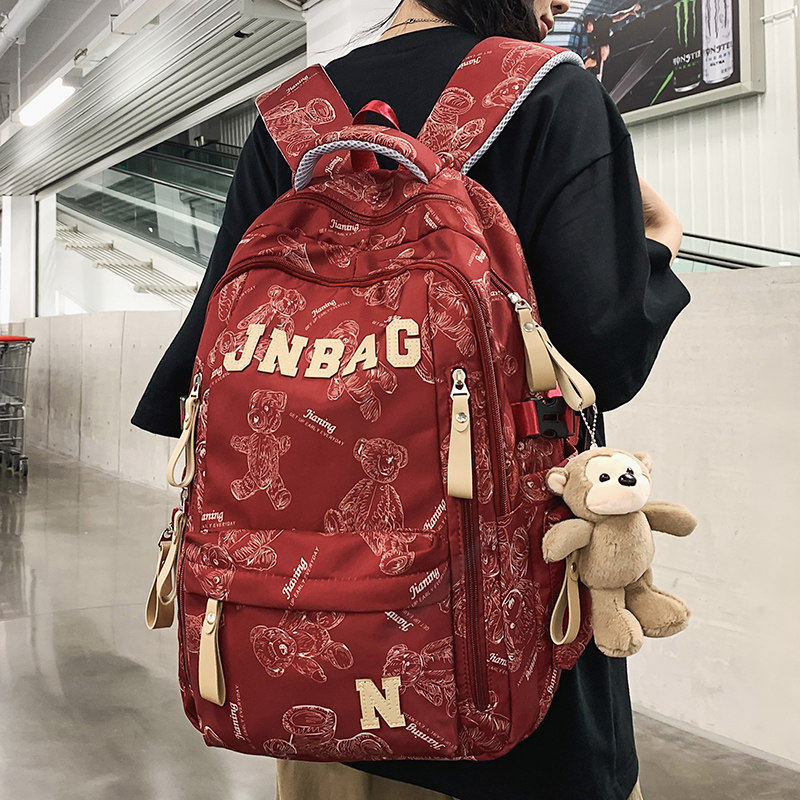 法国DUDK新款轻便护脊旅行背包初高中生大学生轻便大容量书包