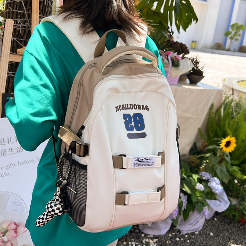 初中生书包女大学生原创简约大容量高中学生减负护脊背包女双肩包