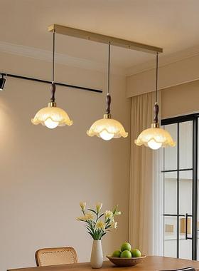 Three-headed chandeliers at the French mid-winding restauran