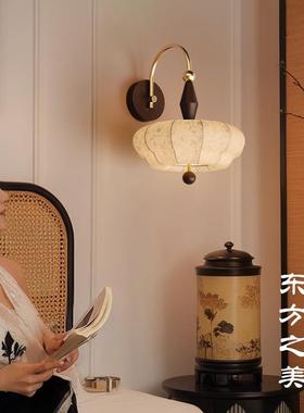 An art lamp on the bedroom bedside walllight in the backgrou