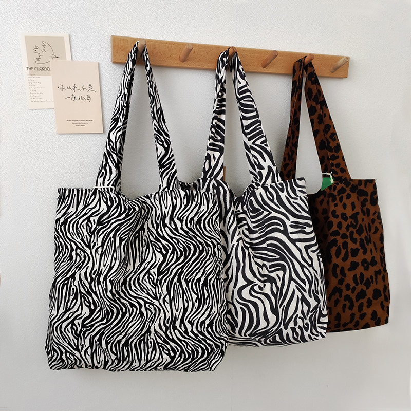 原创设计斑马纹慵懒风ins文艺手拎单肩通勤购物袋帆布学生女包包