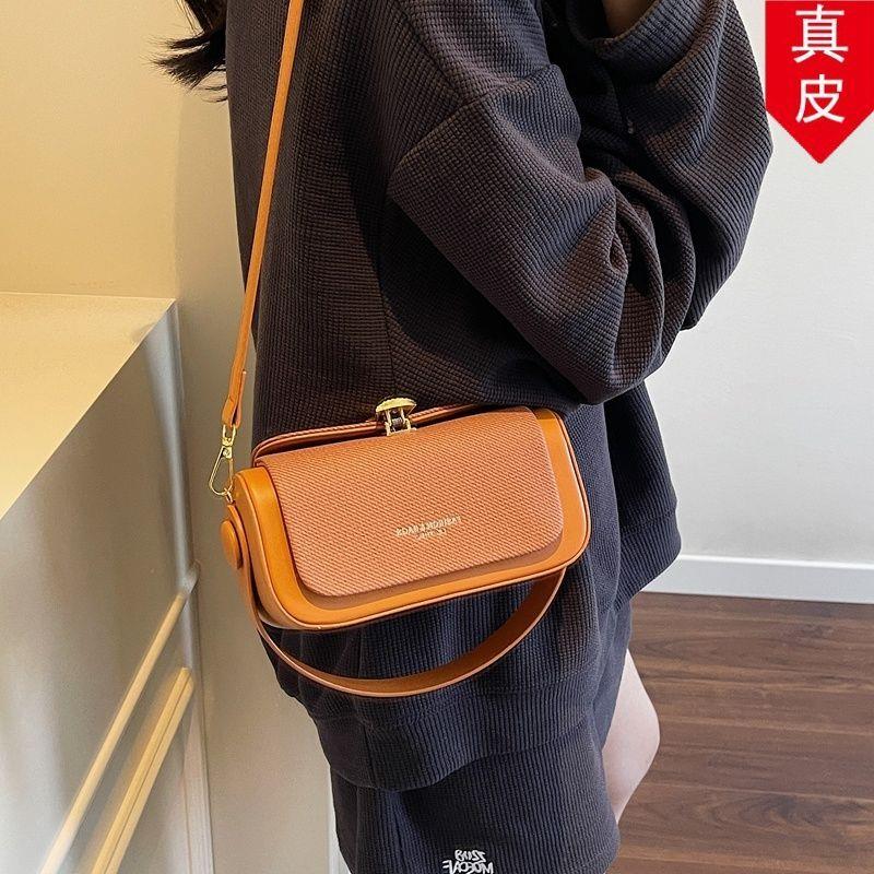 洋气红斜女包包跨宽带网真皮休闲包2026时尚百搭小众水桶复古新款