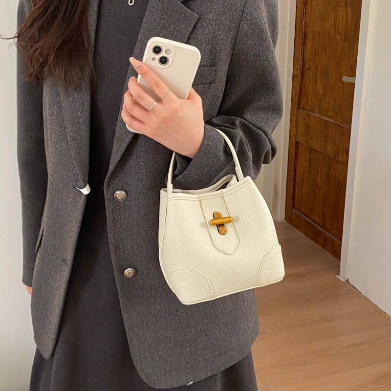 韩版时尚手提包小拎包女2026新款简约水桶包春季百搭单肩斜挎包