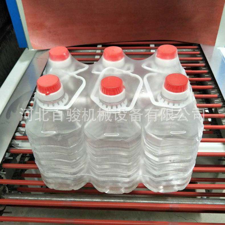 矿泉水袖口热收缩式包装机 矿泉水热收缩膜包装机 纯净水包装机