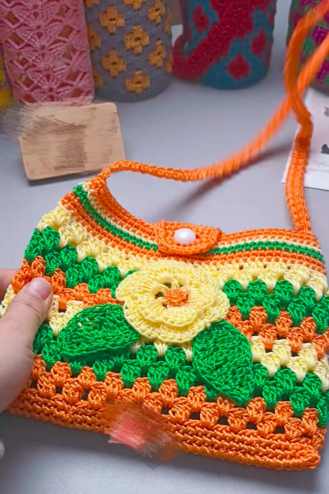 新款2026桔黄绿色斜挎包休闲纯手工锁扣长款编织防摔手机包