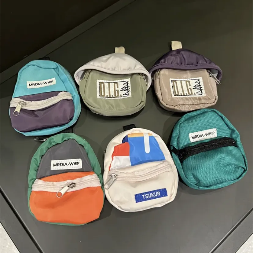 多巴胺潮流旅游小书包手机壳通用高颜值耳机防丢收纳包挂件男女款