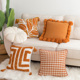 轻奢复古橘色千鸟格抱枕ins风客厅花朵刺绣靠垫圆形白色沙发靠枕