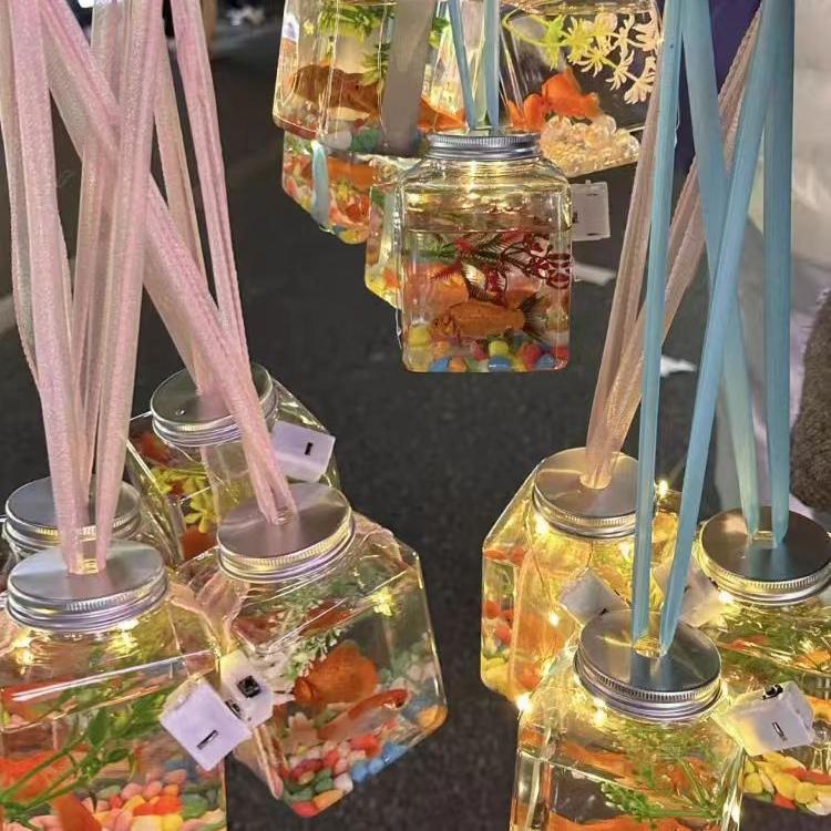 夜市网红罐罐鱼摆地摊发光玩具