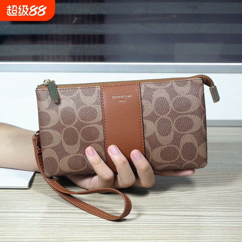 欧美时尚女士手拿包2026新款印花迷你手腕包装手机卡位手抓零钱包